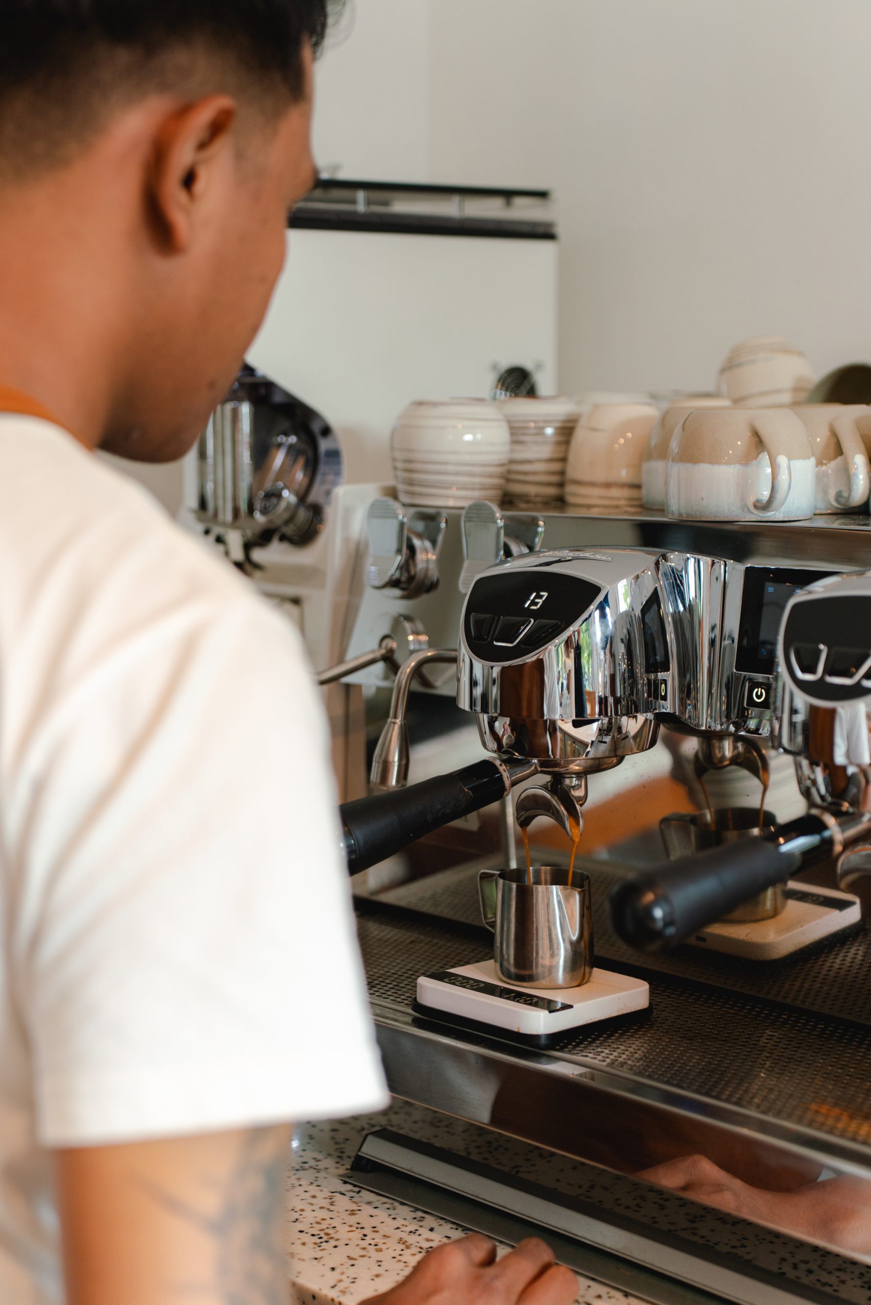 a man is making coffee