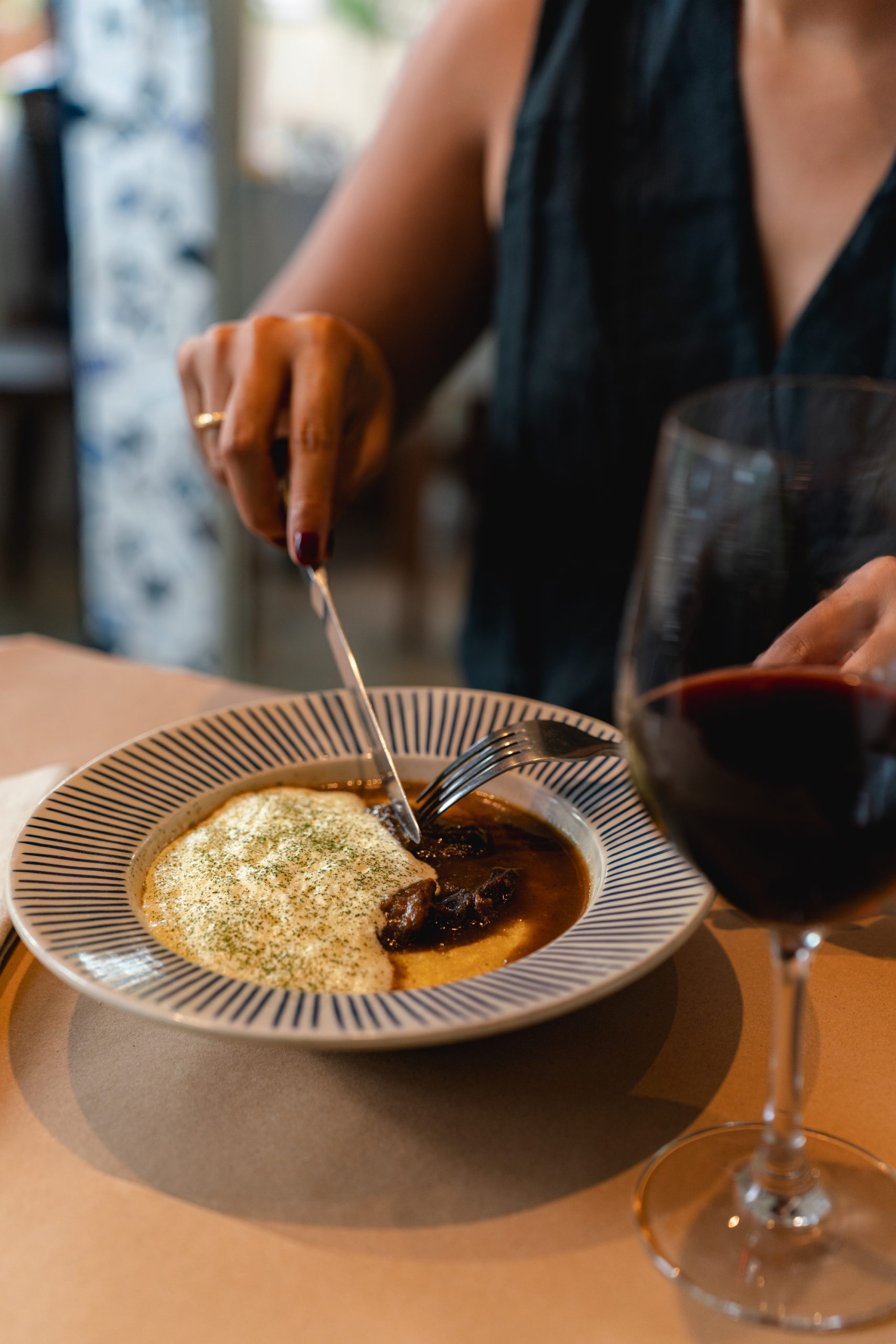 A soup and a glass of wine