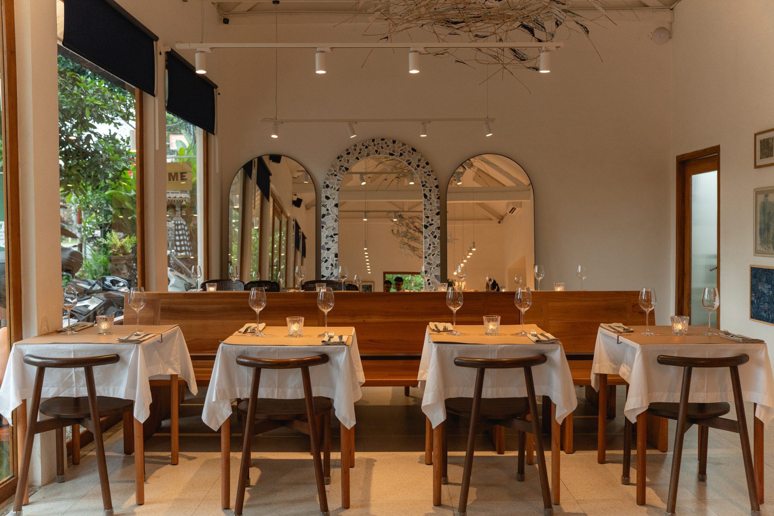 Four tables set for dinner at Ame Bistro & Coffee